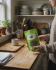 Plot Twist Mint Tea | Darjeeling & Peppermint Black Tea Blend in a kitchen setting, showcasing the tea package.