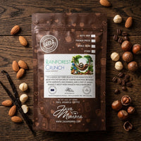 Thumbnail for Overhead flatlay of Java Momma Rainforest Crunch bag with raw almonds, hazelnuts, macadamia nuts, and a vanilla bean