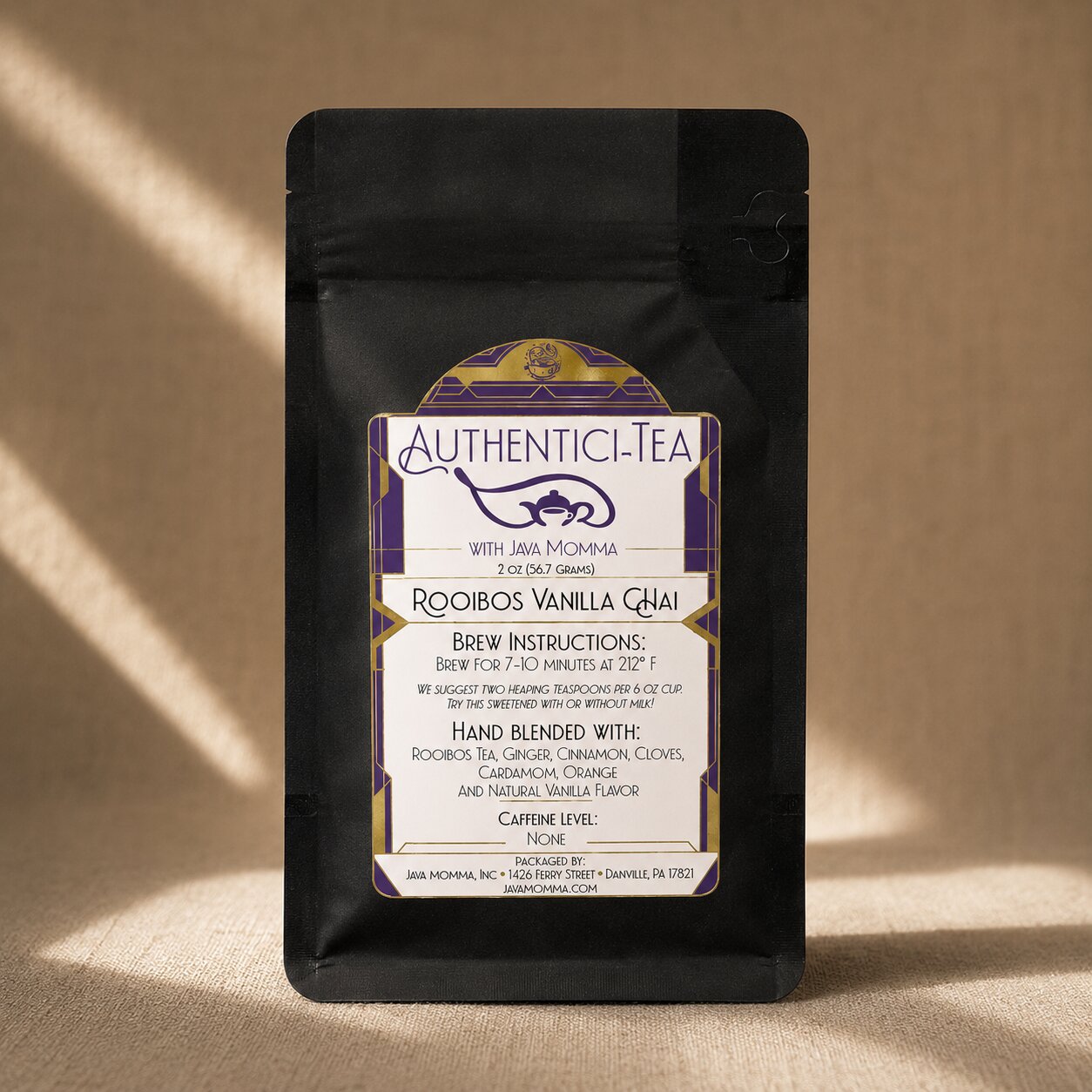 Rooibos Vanilla Chai in Black tea package with 'Authentic Tea' label on a beige background