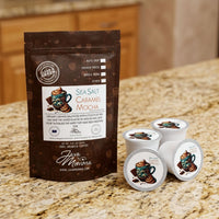 Thumbnail for Java Momma Sea Salt Caramel Mocha coffee package with four pods on a countertop.
