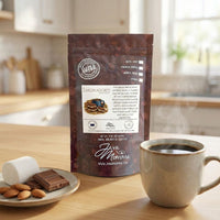 Thumbnail for Bag of S'moreadores coffee next to a steaming mug and marshmallow props.