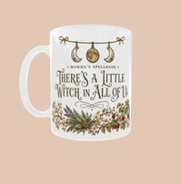 Thumbnail for There's a Little Witch in All of Us Mug with floral design and moon charm garland for your cozy coffee moments.