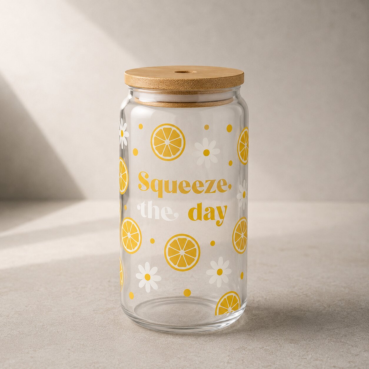 Glass jar with wooden lid featuring lemon and flower design on a neutral background