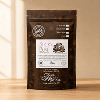 Thumbnail for Java Momma Sticky Bun flavored coffee bag on a warm wood surface