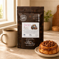 Thumbnail for Java Momma Sticky Bun flavored coffee package with a sticky bun and mug on a table