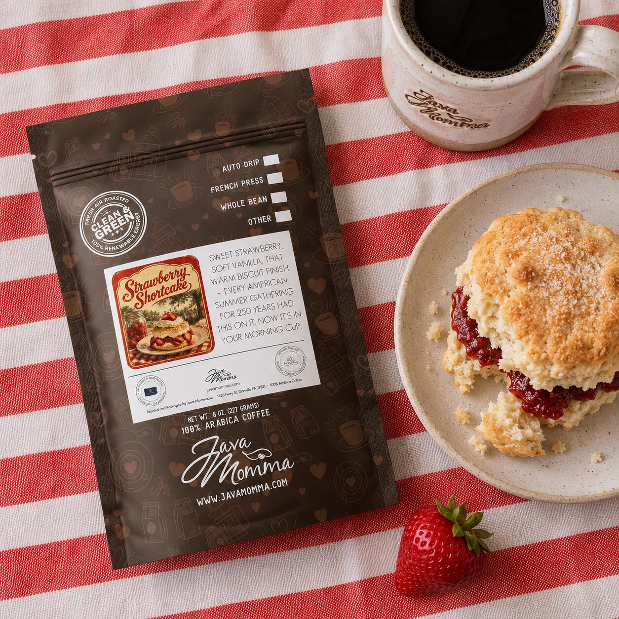 Java Momma Strawberry Shortcake coffee package with a shortcake and strawberry on a red and white striped tablecloth