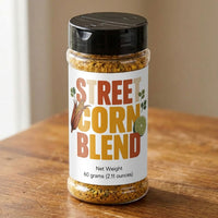 Thumbnail for Street Corn Seasoning Blend bottle on a wooden table showcasing the delicious seasoning mix for street corn.