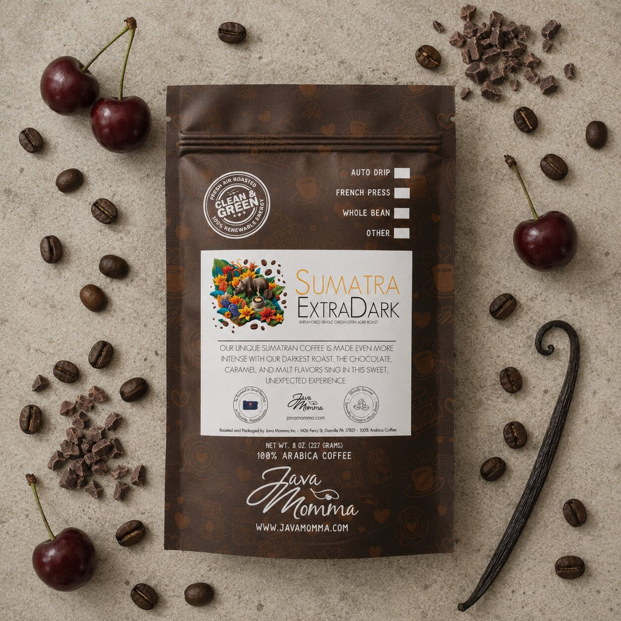 Java Momma Sumatra Extra Dark coffee package with cherries, chocolate, and vanilla on a textured surface