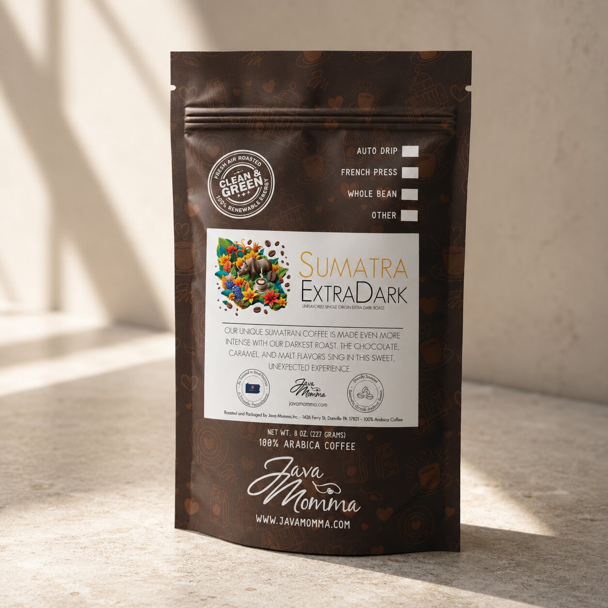 Bag of Java Momma Sumatra Extra Dark coffee on a warm wood surface