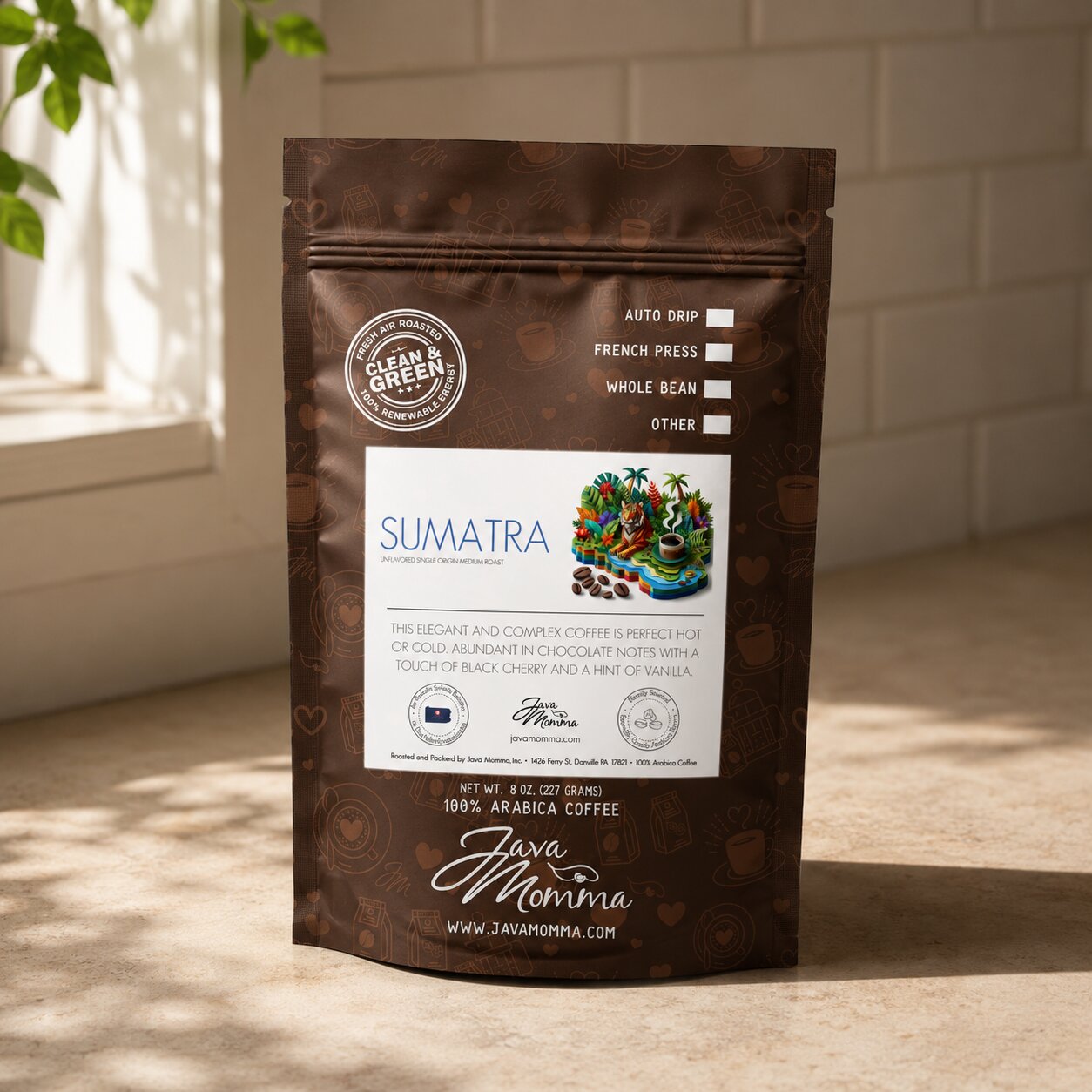 Bag of Java Momma Sumatra Medium Roast coffee on a warm wood surface
