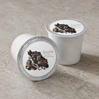 Thumbnail for Two Java Momma Sumatra Satin Dark Roast single-serve coffee pods on a kitchen counter