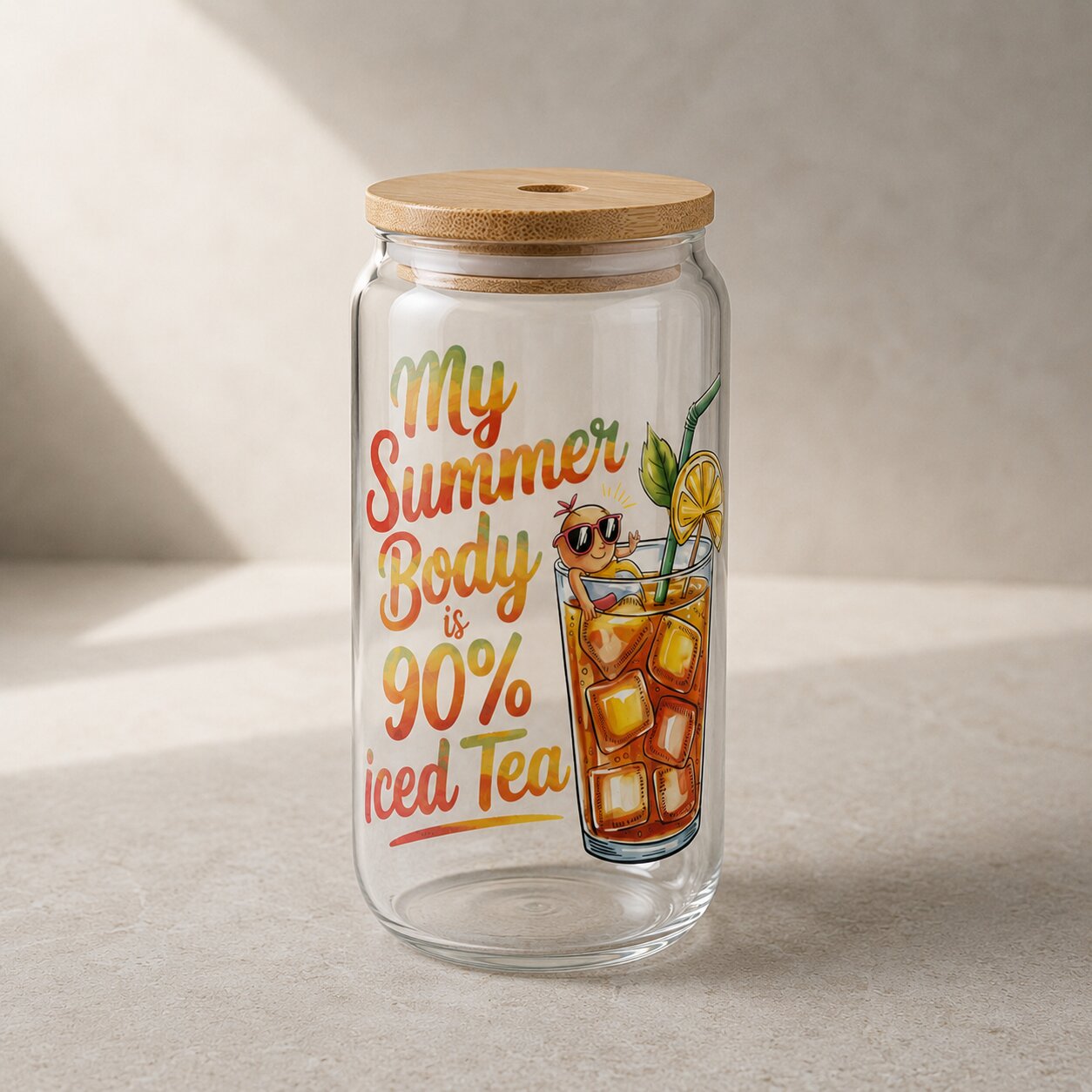 Clear glass jar with wooden lid featuring iced tea illustration and text on a neutral background