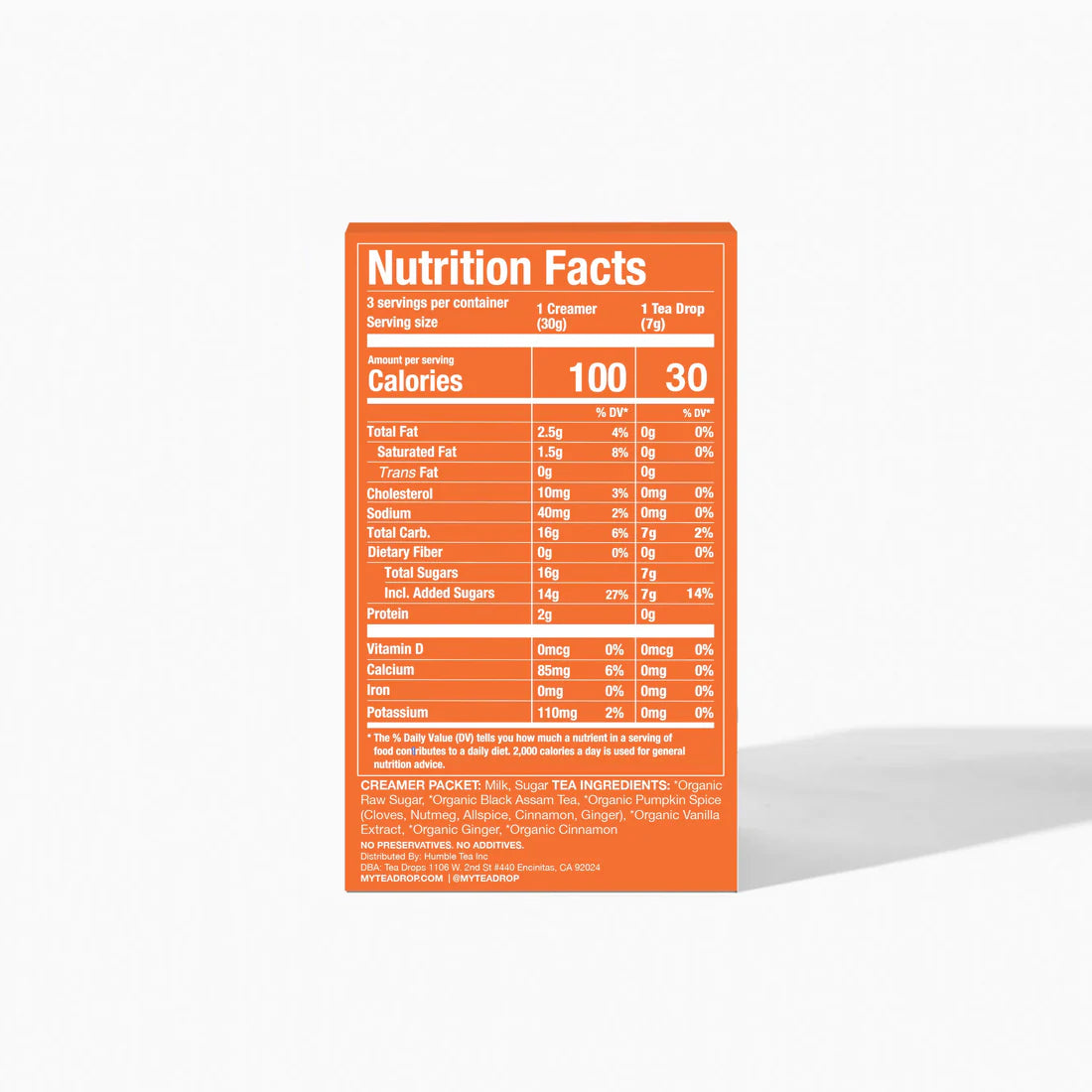 An orange and white nutrition label for the Pumpkin Spice Latte Kit – Fall’s Coziest Tea Latte Gift Set 🎃☕🍁 from Tea Drops shows serving info—calories, fat, sodium, carbs, sugars, protein & vitamins. Ingredients appear below. Perfect fall gift!.