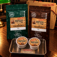 Thumbnail for Unidentified Fried Object Coffee | Momma's Picks packages with cups on a tray, showcasing deep-fried chocolate coffee treat.