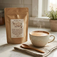 Thumbnail for Vanilla Chaga Chai Latte drink mix bag next to a steaming cup of chai latte.
