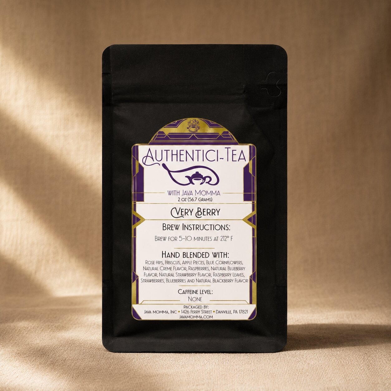 very berry tea by Java momma in black packaging on a beige surface

