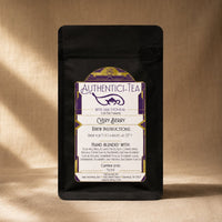 Thumbnail for very berry tea by Java momma in black packaging on a beige surface
