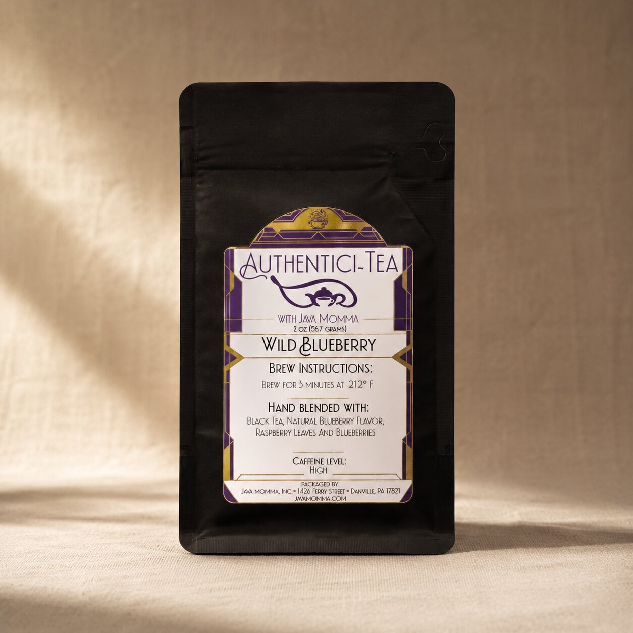Wild Blueberry Black Java Momma tea package with a label on a beige background