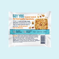 Thumbnail for The Maple Pecan YES Bar® – Sweet, Salty, and Oh-So-Satisfying comes in white packaging with orange and blue text, highlighting its plant protein, fiber, vegan, grain-free, and gluten-free qualities. A nut- and seed-packed bar image appears on the right.